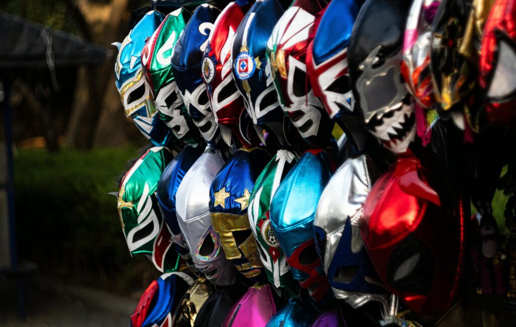 series of wrestling masks on a wall